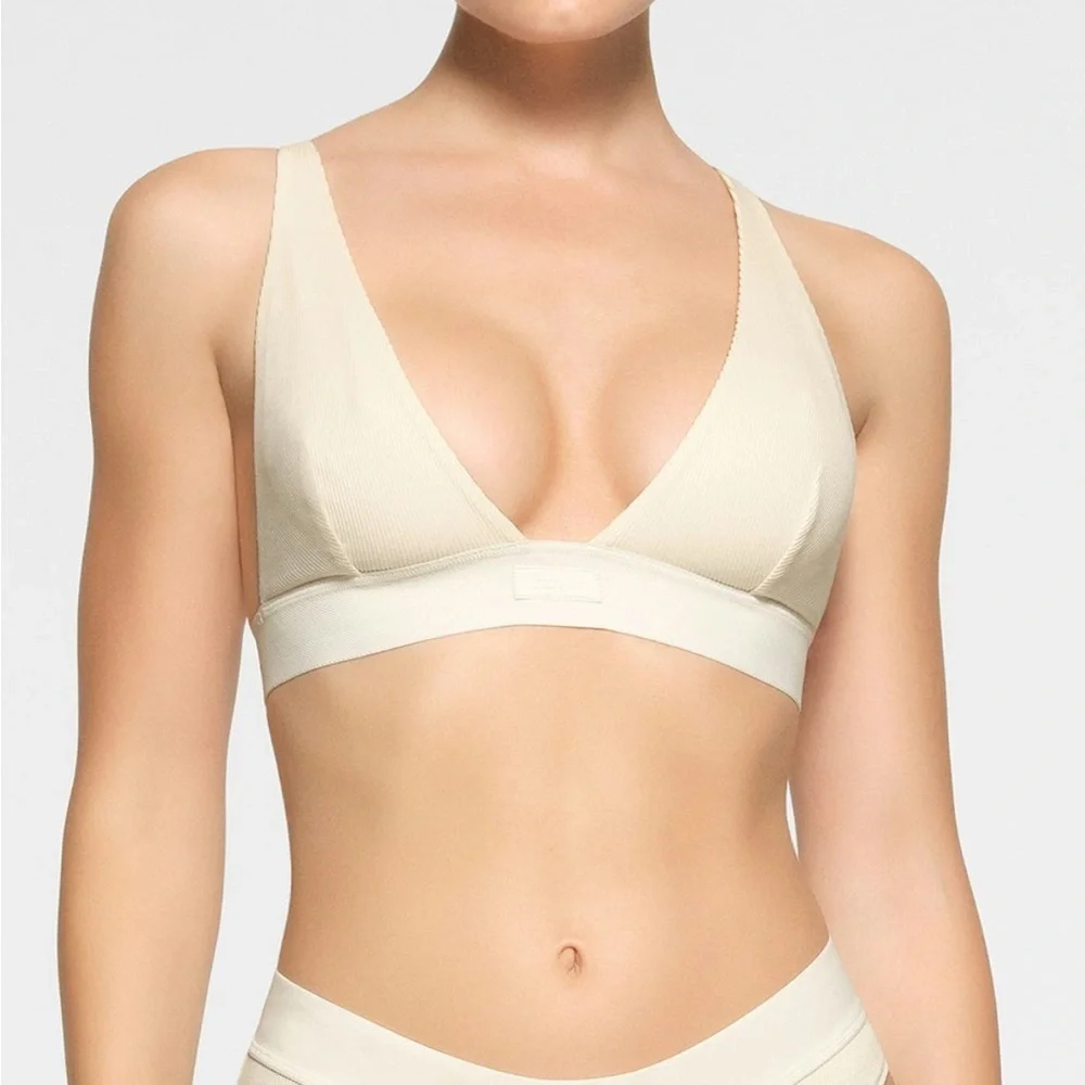 SKIMS Ribbed Triangle Bralette in Cream - Picture 1 of 8